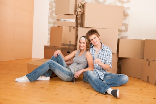 Moving van and packed boxes for removals in Ravenscourtpark