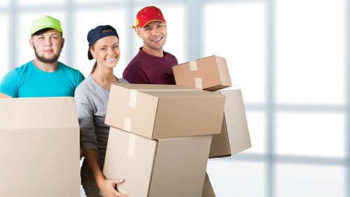 Packed office furniture and equipment prepared for local relocation