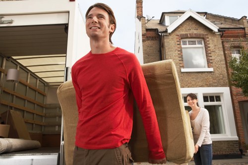 Local furniture collection team removing old sofas and wardrobes