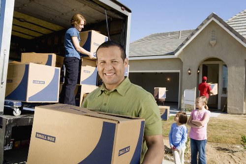 Careful furniture handling during a home move in West London