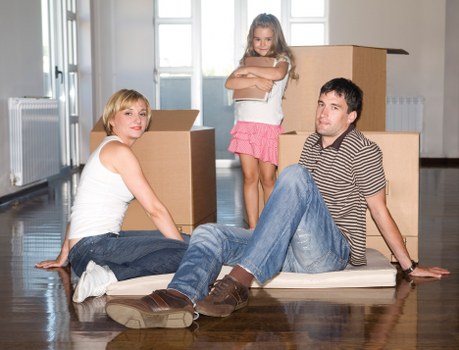 Unpacking and organizing boxes in a new Ravenscourtpark property after moving